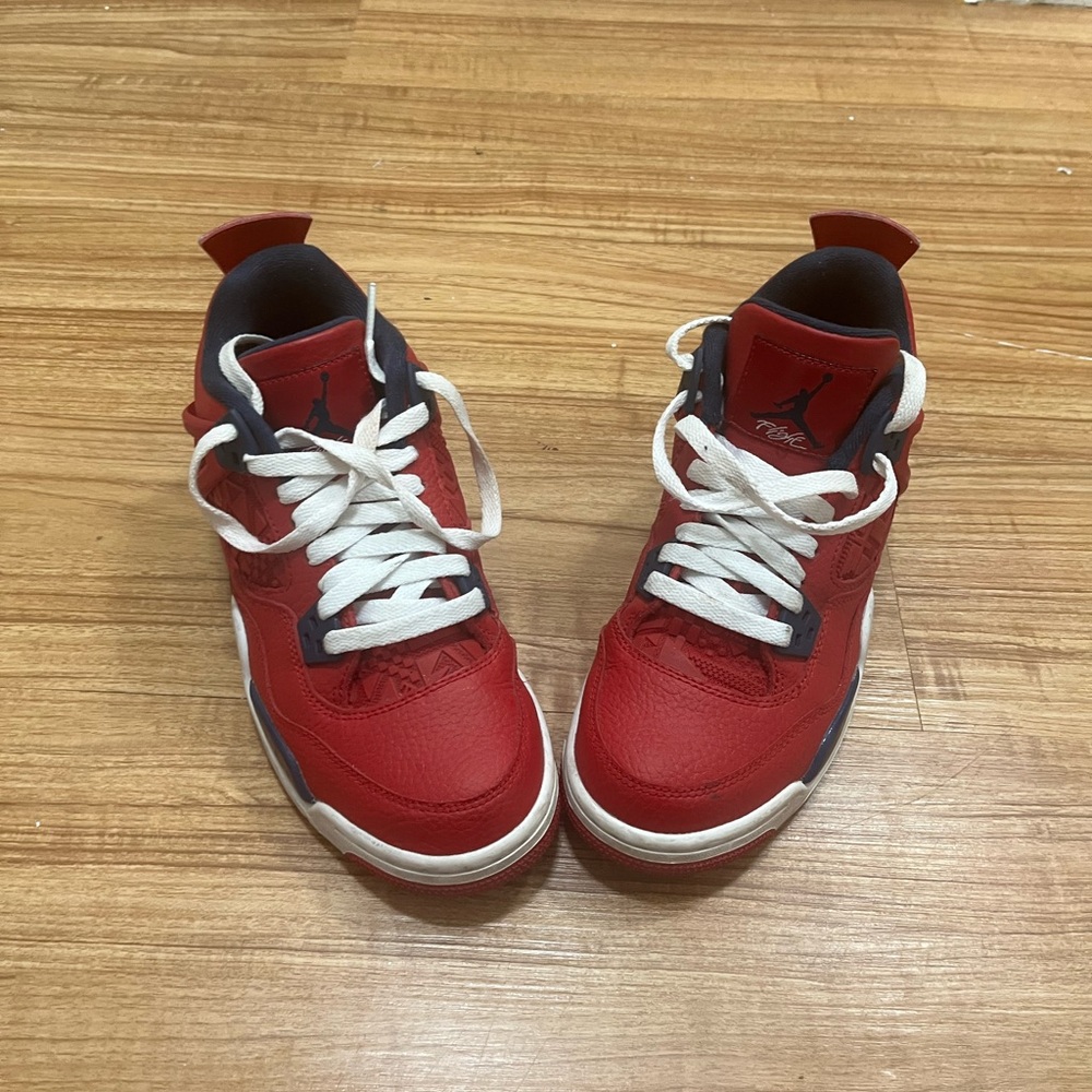 Jordan Red and Black boys size 6Y or women size 7 or 8 can fit